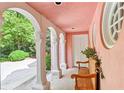 Charming porch with arches and wooden benches at 4705 Paran Nw Vly, Atlanta, GA 30327