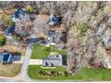 Aerial view of a home showcasing its landscaping, driveway, and surrounding neighborhood at 2630 Amber Creek Dr, Douglasville, GA 30135