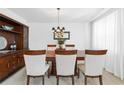 Dining room features a large wooden table, six chairs, a china cabinet and neutral decor at 5330 Willow Park Blvd, Atlanta, GA 30349