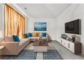 Bright and airy living room with a large sectional sofa, stylish rug, and modern entertainment center at 5330 Willow Park Blvd, Atlanta, GA 30349