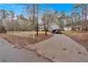 Long driveway leading up to the house, carport and shed at 303 Fireside Trl, Douglasville, GA 30134