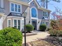 Well-maintained exterior with an arched window, creating an inviting entrance to the home at 3304 Woolbridge Ct, Marietta, GA 30062
