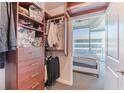 Walk-in closet with custom shelving leading into the bedroom at 400 W Peachtree Nw St # 3412, Atlanta, GA 30308