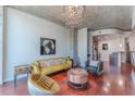 Bright living room with hardwood floors and a modern chandelier at 400 W Peachtree Nw St # 3412, Atlanta, GA 30308