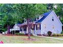 Lovely home with a charming front porch and well-maintained lawn at 410 Invector Ct, Locust Grove, GA 30248