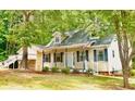 Inviting home featuring a cozy front porch and classic design at 410 Invector Ct, Locust Grove, GA 30248