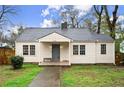 Inviting single-story home with a neatly landscaped lawn and a welcoming covered front porch at 996 Moreland Se Ave, Atlanta, GA 30316