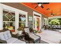 Spacious front porch with comfortable seating, ceiling fans, and inviting decor at 1402 Belmont Sw Ave, Atlanta, GA 30310
