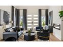 Bright living room featuring a modern fireplace, chic decor, and a stylish seating arrangement at 1041 Walker Se Ave, Atlanta, GA 30316