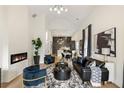 Open-concept living room with a fireplace, modern furnishings, and seamless flow to the dining area at 1041 Walker Se Ave, Atlanta, GA 30316