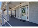Charming front porch with stylish accents and a welcoming entrance to the beautiful home at 4460 Wimberly Way, Cumming, GA 30028