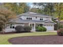 Charming two-story home with a manicured lawn and an attached two-car garage at 2262 Abby Ne Ln, Atlanta, GA 30345