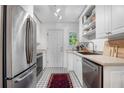 Bright kitchen with stainless steel appliances, sleek countertops, and patterned tile flooring at 885 Briarcliff Ne Rd # 16, Atlanta, GA 30306