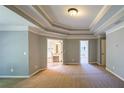 Spacious main bedroom featuring tray ceilings and ensuite bath access at 2088 Hedgewood Trce, Lawrenceville, GA 30043