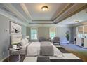 Relaxing main bedroom with sitting area, natural light, and neutral tones at 2088 Hedgewood Trce, Lawrenceville, GA 30043