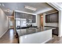 Modern kitchen with stainless steel appliances, granite countertops, and ample cabinet space at 3082 Cedar Glade Ne Ln, Buford, GA 30519