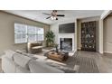 Comfortable living room with a fireplace and a modern bookshelf at 3082 Cedar Glade Ne Ln, Buford, GA 30519
