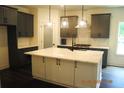 Modern kitchen with gray cabinets, white countertops, a large island, and stainless steel appliances at 127 Old Alabama Se Rd, Emerson, GA 30137