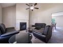 Spacious living room with ample seating, a cozy fireplace, and neutral color palette at 1743 Wee Kirk Se Rd, Atlanta, GA 30316