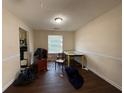 Bright dining room with wood floors, wainscoting and an adjacent view into the kitchen at 2625 Thunder Basin Way, Douglasville, GA 30135