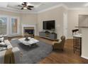 This open living room is flooded with light and offers fireplace, balcony and breakfast bar seating at 10 Perimeter Summit Ne Blvd # 2405, Atlanta, GA 30319