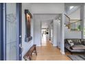 Light-filled foyer with hardwood floors and decorative wall art at 3261 Turtle Lake Se Ct, Marietta, GA 30067