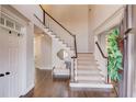 Elegant foyer features a staircase, hardwood floors, and ample natural light at 1175 Lamont Cir, Dacula, GA 30019
