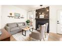 Cozy living room features a dark wooden fireplace and modern decor at 651 Park Village Ne Dr, Atlanta, GA 30306