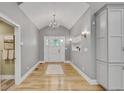 Elegant foyer with recessed lights, light wood floors, and white trim at 1233 Poplar Grove Ne Dr, Atlanta, GA 30306