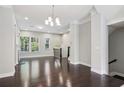Spacious living room with hardwood floors, bright windows, and a staircase at 1829 Hislop Ln, Atlanta, GA 30345