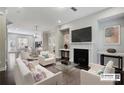 Bright living room featuring a fireplace, modern furniture and an open floor plan at 1829 Hislop Ln, Atlanta, GA 30345