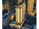 Stunning aerial view of a high-rise building with a rooftop pool and breathtaking city skyline at 860 Peachtree St # 1418, Atlanta, GA 30308