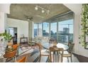 Open living space with floor to ceiling windows providing plentiful natural light and city views at 860 Peachtree St # 1418, Atlanta, GA 30308