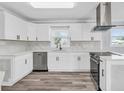 Modern kitchen featuring white cabinets, stainless steel appliances, and stylish countertops at 2917 Mcafee Rd, Decatur, GA 30032