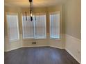 Bright dining area featuring new floors, updated lighting and multiple windows at 501 Owens Springs Ln, Mcdonough, GA 30252