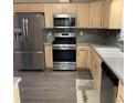 Modern kitchen featuring stainless steel appliances, and light colored cabinetry at 501 Owens Springs Ln, Mcdonough, GA 30252