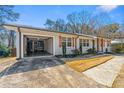 Attached single car garage showcasing a gray stained floor and white brick exterior at , Tucker, GA 30084
