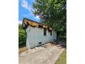 Exterior view of a fire damaged building with debris on the ground at 2022 Cook Rd, Decatur, GA 30032