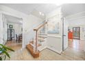 Inviting foyer showcasing a staircase with wood and white accents and bright, neutral decor at 2086 Mountain Creek Ct, Stone Mountain, GA 30087