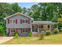 Charming home with a covered front porch offering a welcoming entrance and curb appeal at 3989 Woodland Se Cir, Conyers, GA 30013