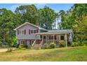 Inviting two-story home featuring a covered front porch perfect for relaxing outdoors at 3989 Woodland Se Cir, Conyers, GA 30013