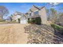 Charming two-story home featuring a two-car garage, landscaped front yard, and inviting front porch at 109 Mill Creek Dr, Canton, GA 30115