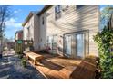 Cozy wooden deck in the backyard, perfect for outdoor seating and relaxation with a small stone area at 2515 Norwood Park Xing, Atlanta, GA 30340