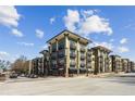 Modern apartment building with multi-level balconies, street views, and convenient walkable access at 5300 Peachtree Rd # 0507, Atlanta, GA 30341