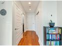 Inviting hallway with hardwood floors, showcasing closet space and access to various rooms at 1080 Peachtree Ne St # 1208, Atlanta, GA 30309