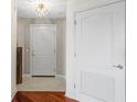 Inviting hallway with tile and hardwood floors leading to various rooms with modern doors at 195 14Th Ne St # 2105, Atlanta, GA 30309