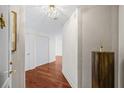 Elegant hallway features hardwood floors, decorative lighting, and stylish wall accents at 195 14Th Ne St # 2105, Atlanta, GA 30309