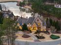 Beautiful stone home with manicured landscaping in a serene environment; an eye-catching property at 938 Crescent River Pass, Suwanee, GA 30024