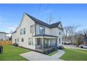 Charming two-story home featuring a covered porch with unique hanging chairs for relaxed outdoor living at 2357 Lynn Iris Dr, Decatur, GA 30032
