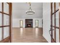 Bright living room with hardwood floors, a cozy fireplace, and large windows at 2681 Beckwith Se Trl, Marietta, GA 30068